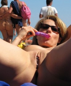Female masturbation on the beach in public