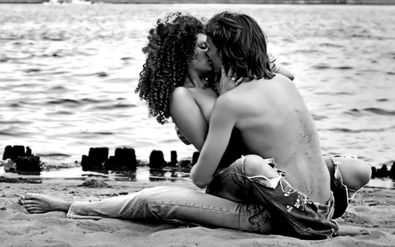 Passionate kiss on the beach