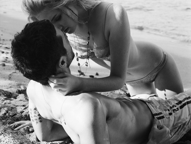 Passionate kiss on the beach