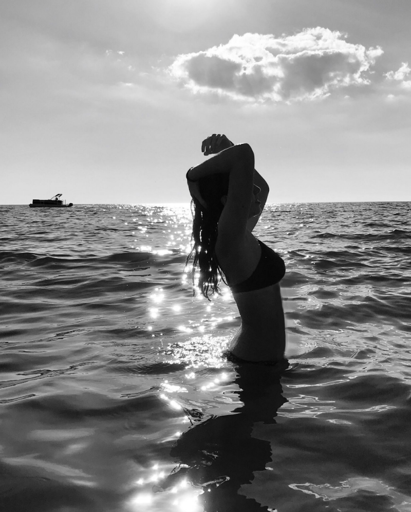 Girl at sea from the back