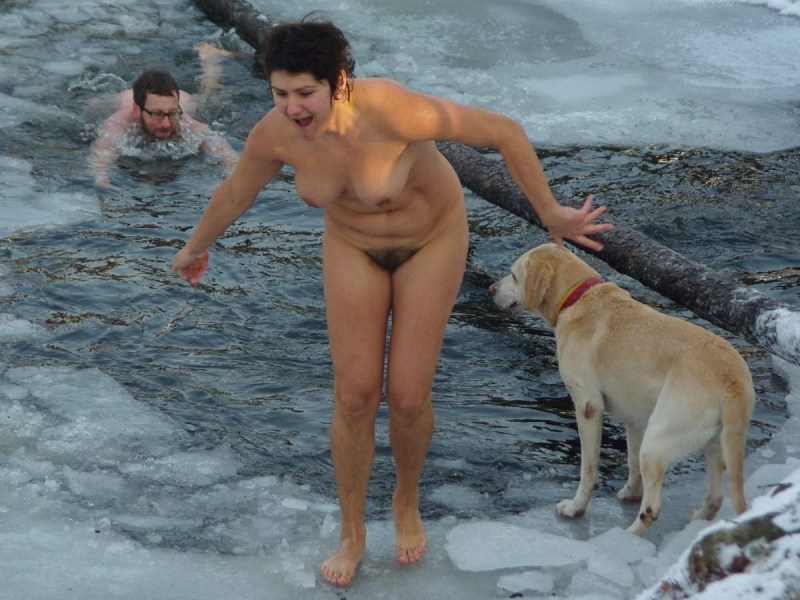 Naked walruses bathe in the hole