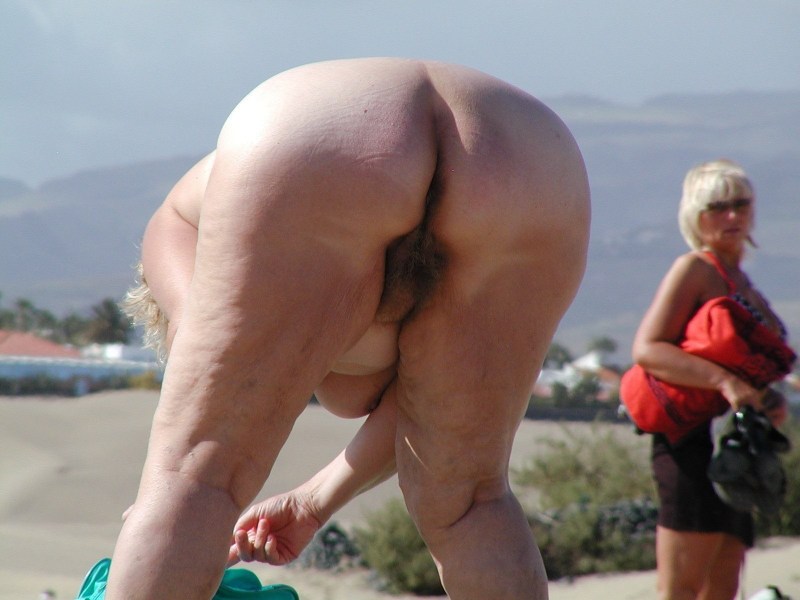 Old women without panties on the beach