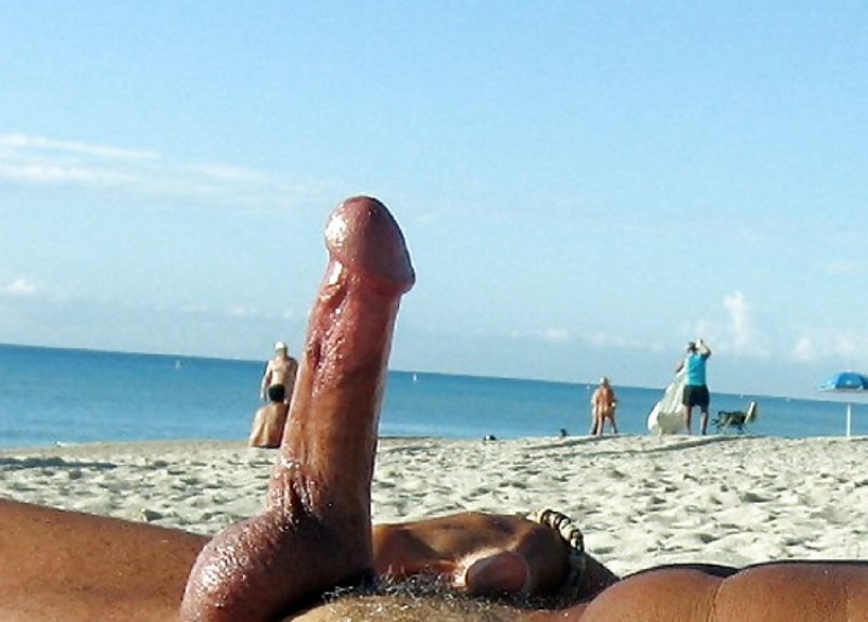 Standing members on a nudist beach