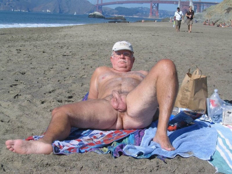 Naked old people with an erection on the beach