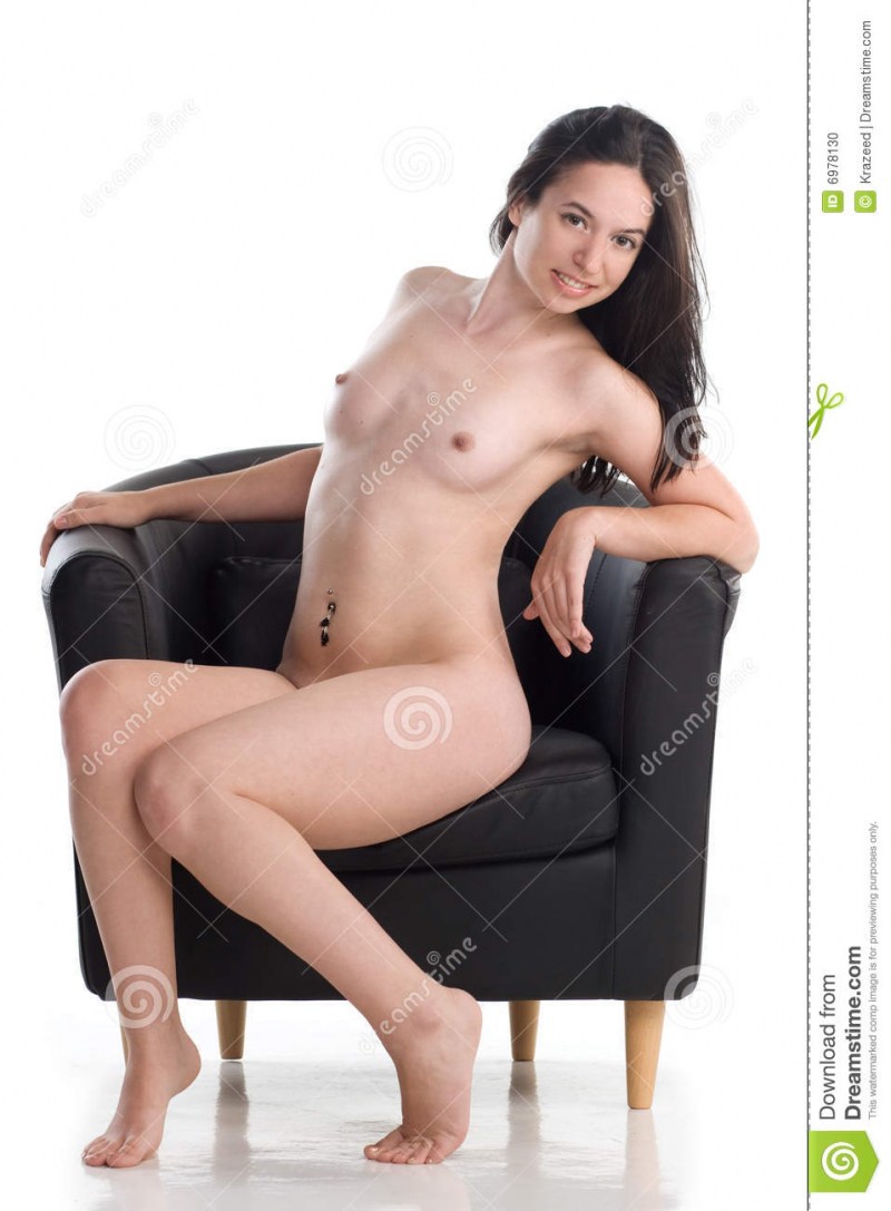 Mature in an armchair spread her legs