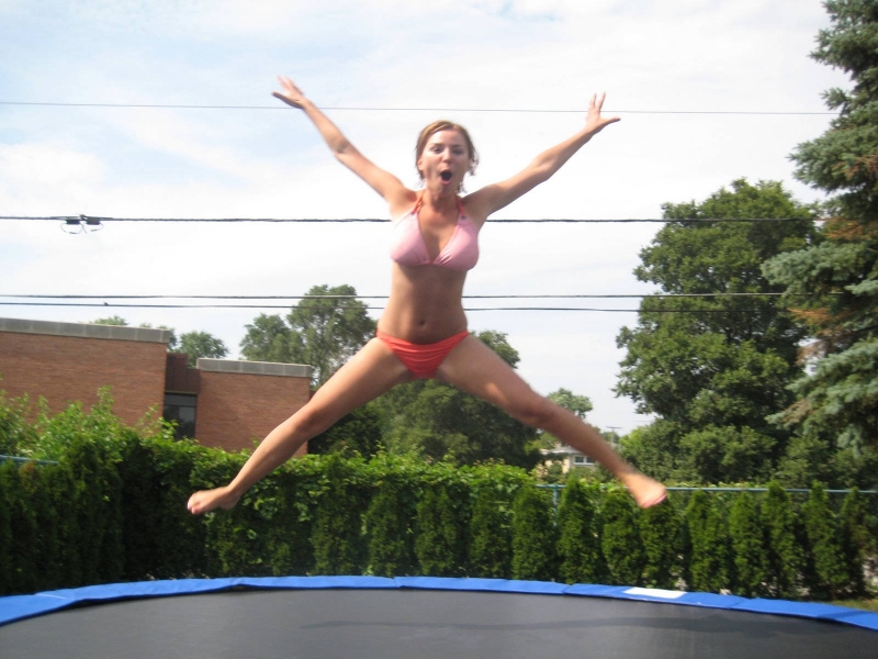 Girl jumping on a trampoline